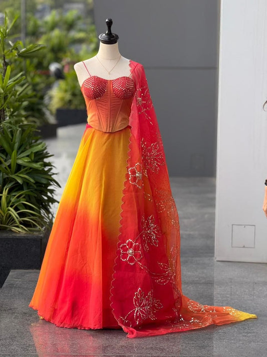 Fully Sequinned Bright Orange Organza Lehenga Choli with 8 Meter Flair and Corset Blouse